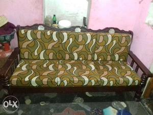 Green Padded Wooden Couch