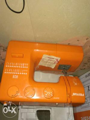 Orange Sewing Machine