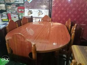 Oval Brown Wooden Table With Six Chairs