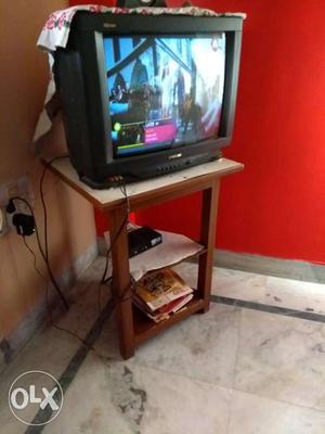Samsung 21inches TV with wooden stand.