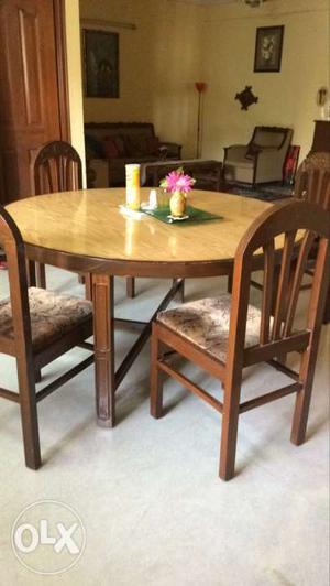 Teak wood dinning table with six chairs in
