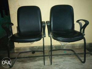 Two Black Cantilever Chairs With Black Pads