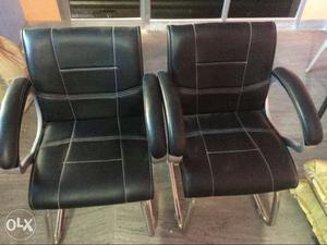 Two Black-and-silver Padded Armchairs