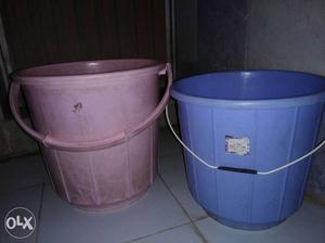 Two Blue And Brown Plastic Pails