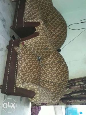 Two Brown And Beige Floral Padded Brown Sofa Chairs