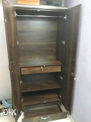 Wooden cupboard used for 2 months. Price negotiable