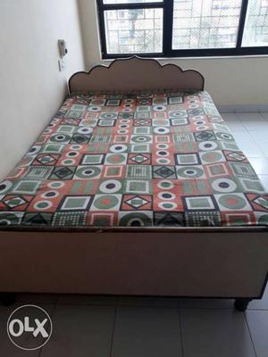 Wooden double bed with matress