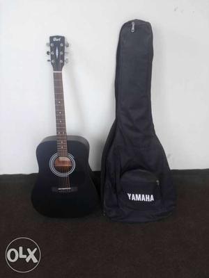 Black Yamaha Acoustic Guitar With Case