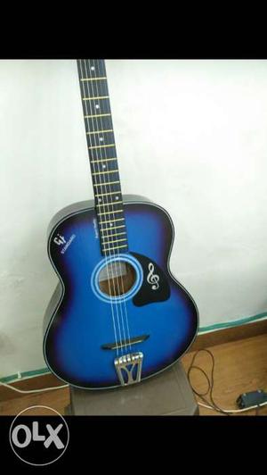 Glossy blue color acoustic guitar, with free pics