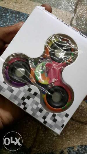 Red, Yellow, And Pink 3-blade Fidget Spinner In Box