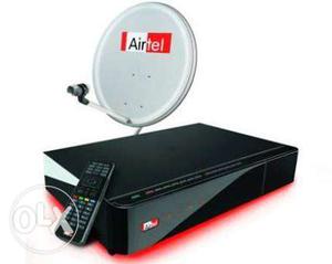 Airtel Set top box with Dish, cable, and remote.