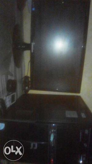 Black Flat Screen Computer Monitor With Computer Tower