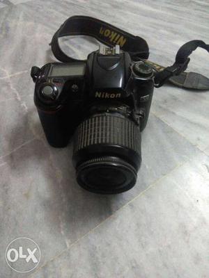Black Nikon DSLR Camera With Strap