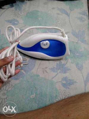 White And Blue Clothes Iron