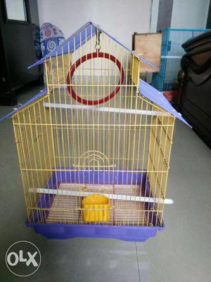 Yellow And Blue Metal Birdcage