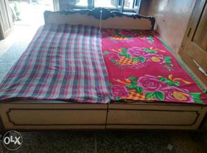 A double wooden bed in good condition