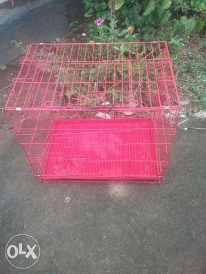 Red metal dog cage