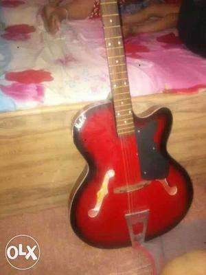 Red semi hollow guitar 3 months old