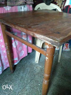 Teak Brown Wooden wall mount dining table.