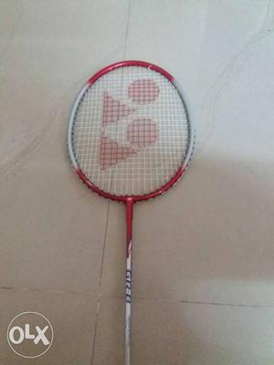 White And Red Badminton Racket