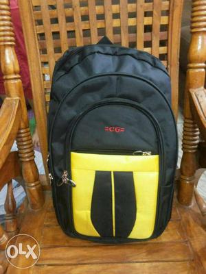 A brand new black And Yellow CG Brand Backpack with warranty