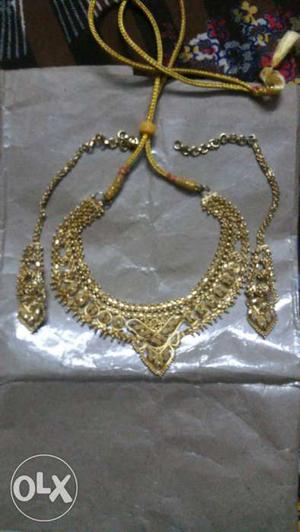 Artificial gold necklace new price is  with earings new