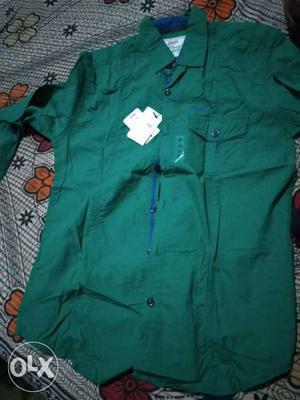 Brand new green shirt small size..totally unused.