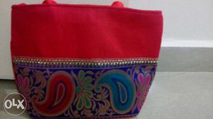 Brand new red and purple handbag