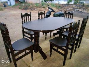 Brown Wooden Oval Table And 6 Chairs