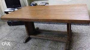 It is teak wood dining table in good condition.