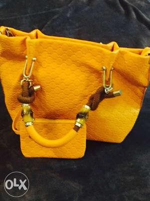 Mango color bag with a wallet as good as new
