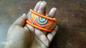 Orange colour embroidered bangle.. finishing made