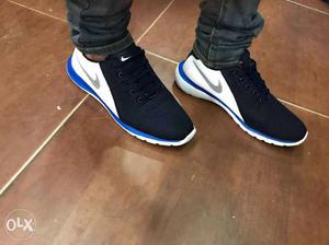 Pair Of Black-white-and-blue Nike Sneakers