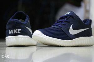 Pair Of Blue-and-white Nike Running Shoes