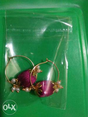 Pair Of Gold And Pink Jewelries