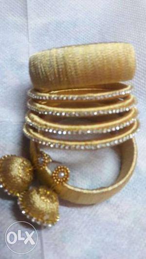 Party wear silk thread gold color bangles set