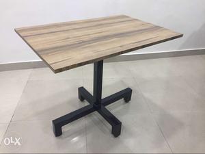 Rectangular Brown Wooden Table With Black Metal Base