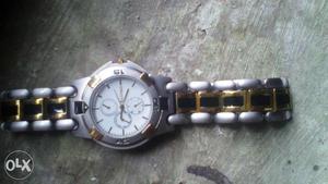 Round Silver And Gold Bezel White Chronograph Watch With