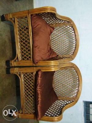 Two Brown Wooden Framed With Brown Pad Armchairs