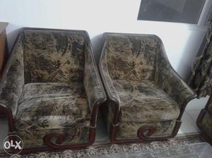 Two Grey And Black Leather Sofa Chairs