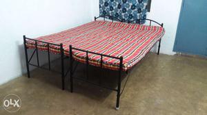 Two single cots with double bed mattress
