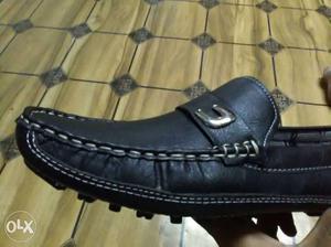 Unpaired Black Loafers