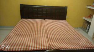 Wooden double bed with mattresses