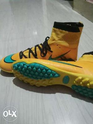 Yellow-and-teal Nike High Top Leather Cleats