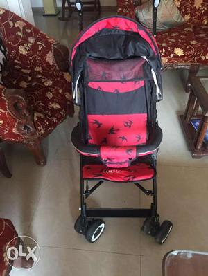 Baby Pram(unused) in red and black colour