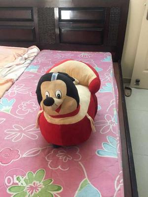 Baby teddy toy with wheels in red, white and black colour