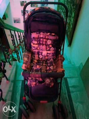 Baby's Purple White And Beige Stroller
