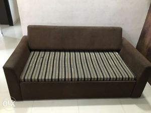 Brown, White, And Black Striped Cushion Sofa