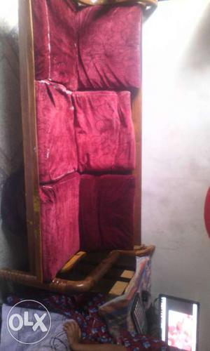 Brown Wooden Framed Red Padded Couch