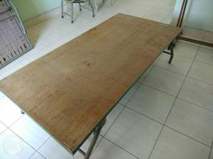 Brown Wooden single folding bed in good condition.